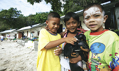 Thai children in front of relief housing in Phuket.